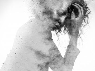 Monochrome splatter painting of a woman in distress