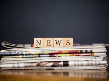 scrabble blocks spelling out the word news 