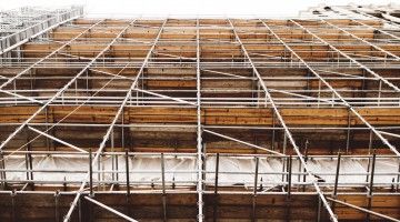A view from the ground up of construction scaffolding around a building