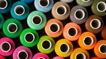Stack of colourful textiles, yarns Thumbnail