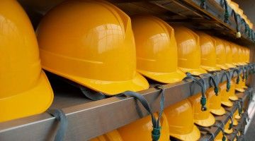 Close-up of hard hats on shelves
