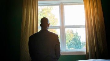 listless_man_stares_out_window Thumbnail