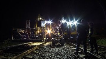 Night shift workers on railway tracks
