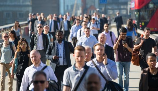 Photo of workers commuting to work on a wide walkway