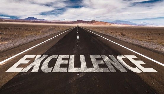 Excellence written on road way