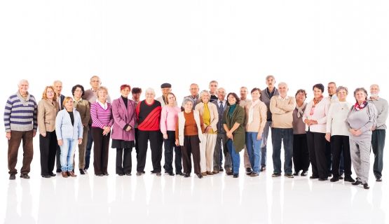 A large group of seniors looking at camera