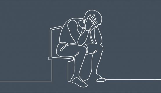 A line drawing of a male figure slumped in a chair, head in hand