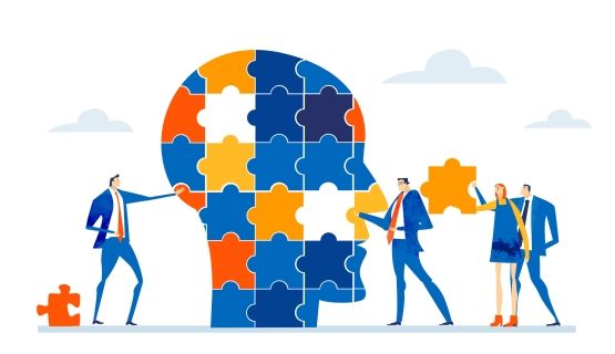 Graphic of people in business suits contributing puzzle pieces to a profile of a head.
