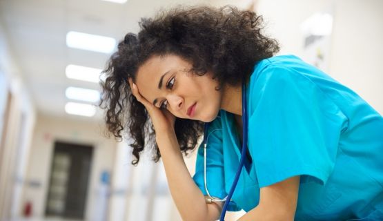 worried nurse in hospital hallway Thumbnail