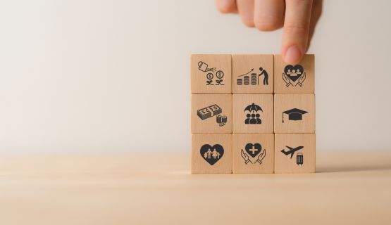 A series of blocks stacked together with icons representing various workplace benefits