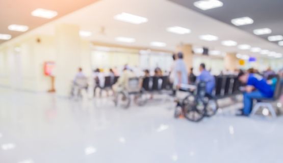 A blurry image of a hospital waiting room