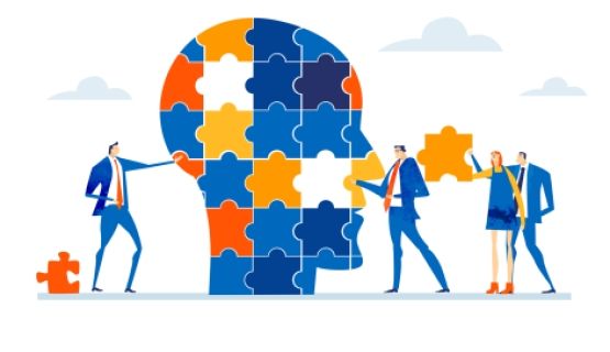 Graphic of people in business suits contributing puzzle pieces to a profile of a head.