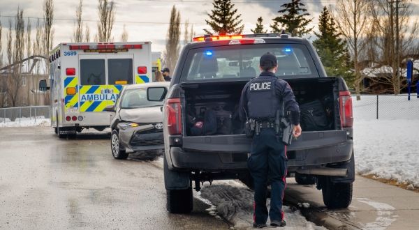 Paramedic and police vehicles at a roadside accident