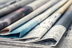 A spread of folded newspapers